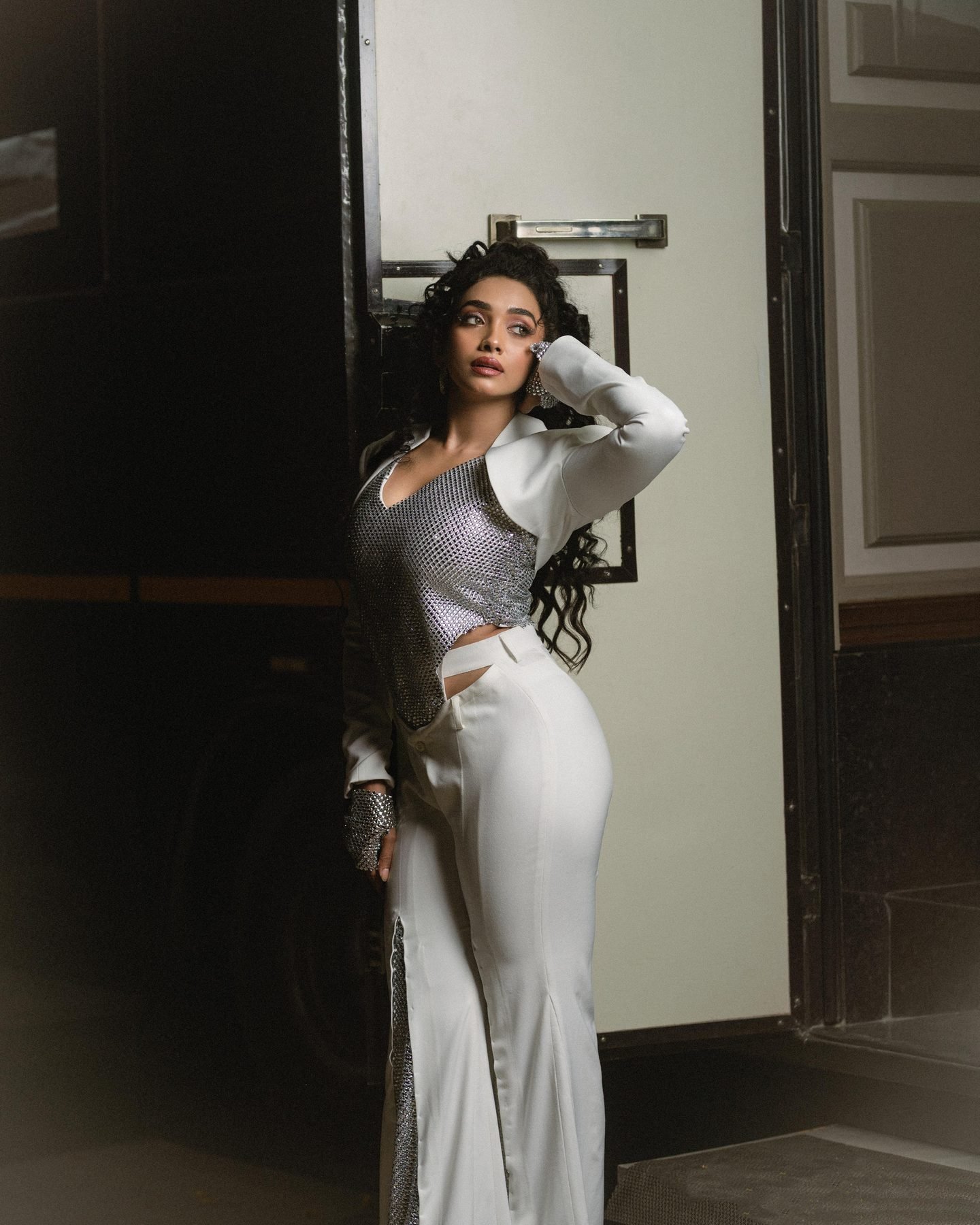 Actress Saanve Megghana in a white and silver stage outfit backstage, makeup by Anu Rotrico