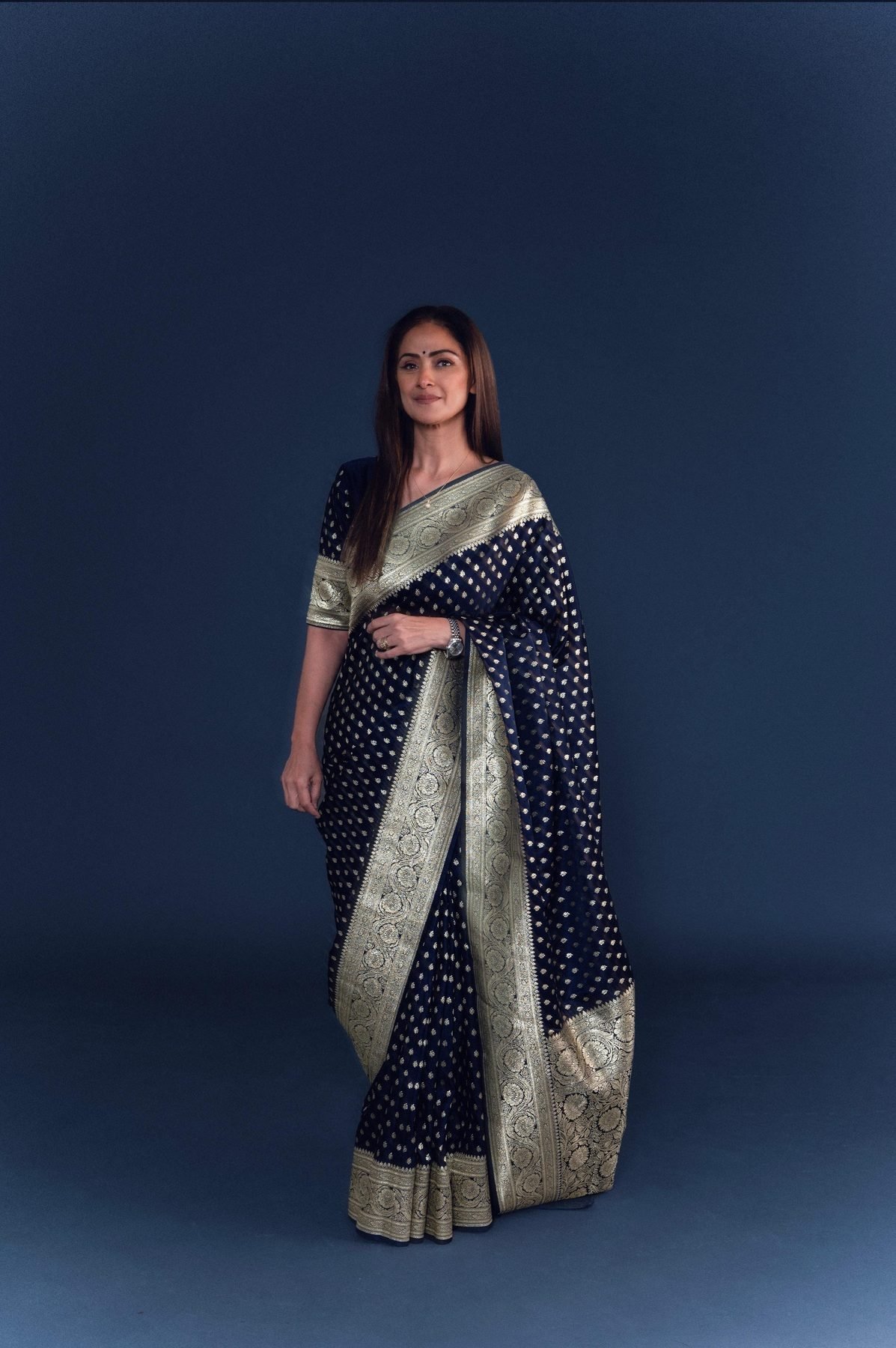 Simran in a full-length navy Banarasi silk saree before the Ananda Vikatan Cinema Awards