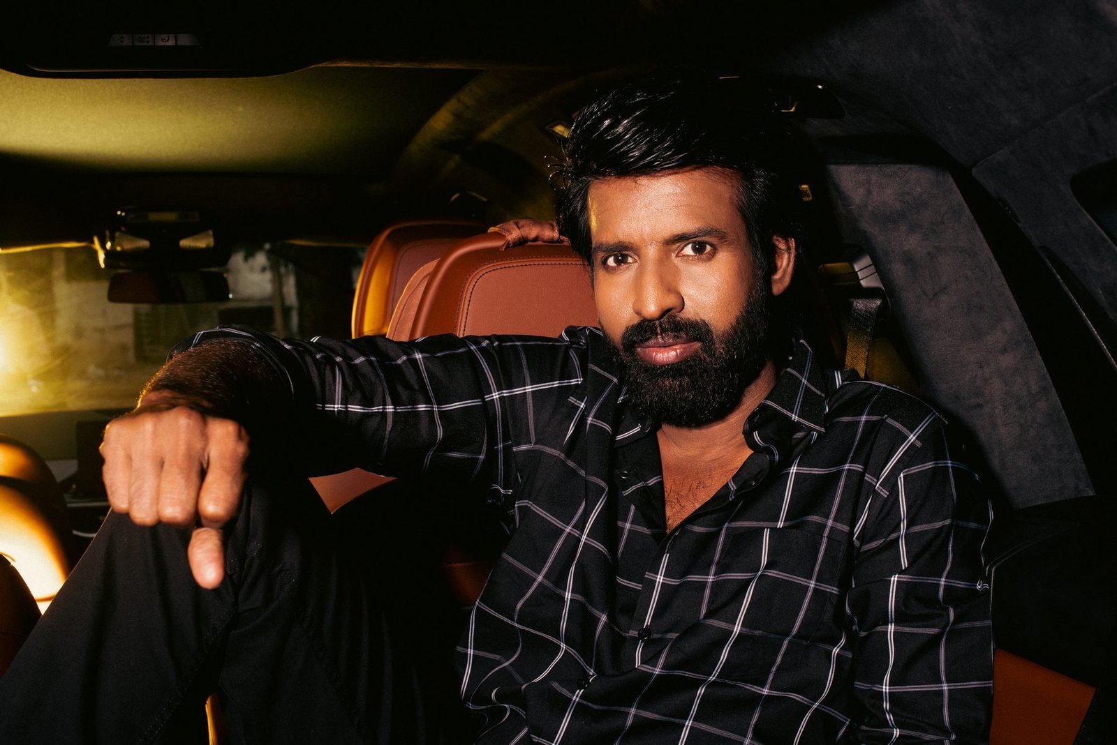 Actor Soori photographed inside a car at night for the Provoke Lifestyle cover, makeup by Anu Rotrico